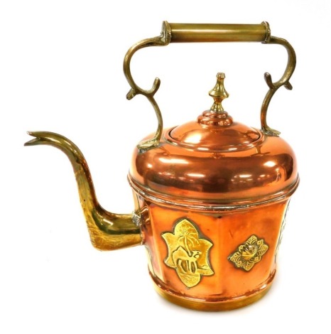 An early 20thC Anglo Egyptian copper and brass kettle, the octagonal panelled sides embossed with flowers and relief panels decorated with camels in a desert, 31cm high.