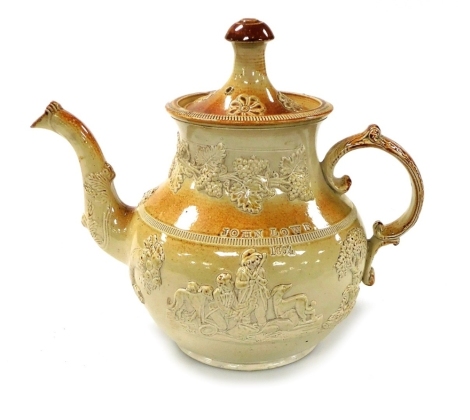 A mid 19thC cream and buff stoneware tea kettle and cover, sprig moulded with hunting figures, cornucopias of fruit and vines, engraved for John Lowe 1864, 26cm high.