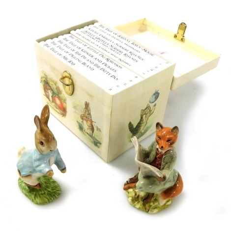 A Royal Albert pottery figure modelled as Peter Rabbit, another of Foxy Reading, both boxed, and a presentation boxed set of Beatrix Potter books, numbers 13-23.