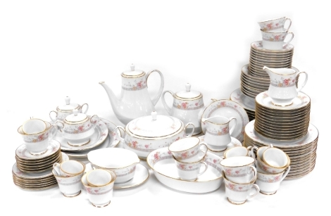 A Noritake Legendary Dream Street porcelain dinner, tea and coffee service, including meat platters, vegetable tureen and cover, oval dish, sauce boat on integral stand, dinner, dessert and side plates, fruit and soup bowls, teacups and saucers, coffee cu