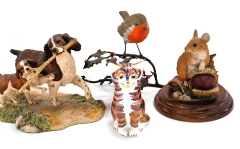 A Royal Crown Derby porcelain Imari paperweight modelled as a seated cat, gold stopper, together with a Royal Doulton sculpture of a wood mouse with a chestnut, a Border Fine Arts figure group modelled as Springer Spaniel and pup (Liver/White) 207A, and a