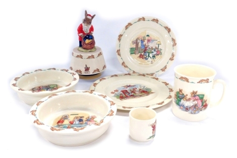 A group of Royal Doulton Bunnykins, comprising two baby bowls, mug, tea and breakfast plates, and an egg cup, together with a carousel of White Christmas. (7)