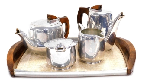 A mid 20thC Picquot ware five piece tea set, comprising teapot, hot water jug, cream jug, sucrier and twin handled tray.