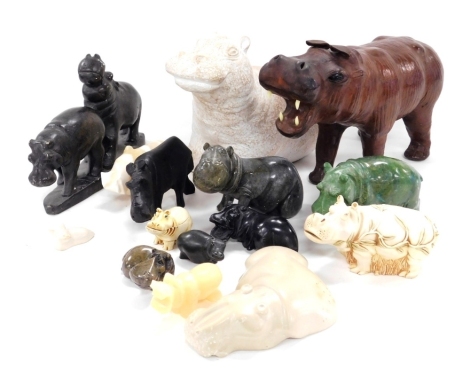 A group of African stoneware, wooden and other figures of hippopotamuses.