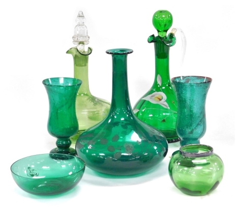 A group of late 19thC green glass, including a Mary Gregory type decanter and stopper, claret jug and stopper, enamel decorated with flowers, and a vase with a silver rim. (7)