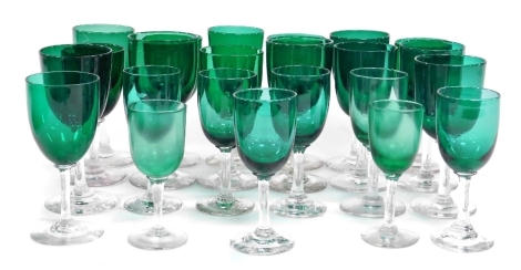 A group of Edwardian green glass wine and spirit glasses. (a quantity)