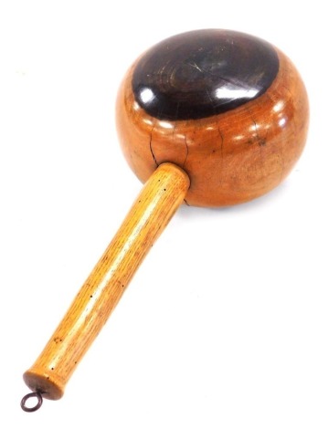 An early 20thC lignum vitae mallet, with an oak handle, 31cm wide.