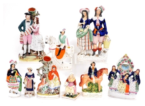 A group of 19thC Staffordshire flatback figures, and spill vases, including C Peard, The Cobbler's Wife, three figural watch holder, and Gipsy Boy. (a quantity)