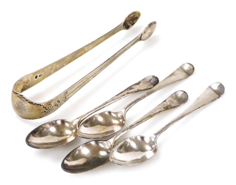 A set of four Georgian silver Old English pattern coffee spoons, monogram engraved, together with a pair of Georgian sugar tongs, bright cut engraved, 2.27oz.