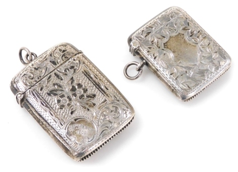 An Edward VII silver Vesta case, bright cut engraved with flowers and leaves, dated 23rd March 1905, Birmingham 1903, together with a further silver Vesta case, bright cut engraved with leaves, vacant cartouche, Birmingham 1908, 1.86oz.