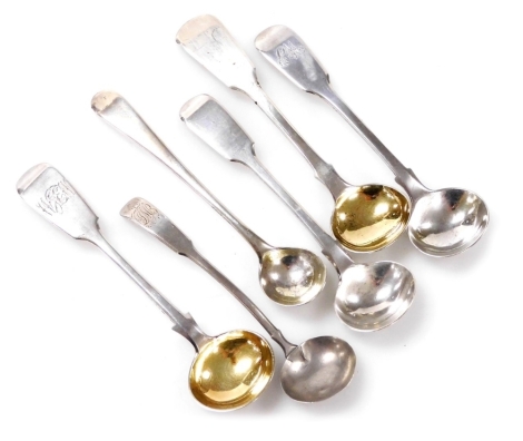 Six George III and later mustard spoons, three monogram engraved, two with gilt bowls, varying dates and assays, 2.23oz.