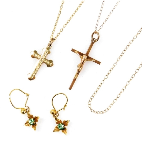 A group of 9ct gold jewellery, including a crucifix pendant, cross on chain, further chains, and a pair of earrings, 5.2g.