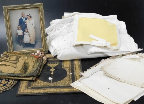 Linen and lace tablecloths, gilt tooled leather blotter, Indian gold wire work double wall pocket, and a framed portrait of the Prince and Princess of Wales and their three children. (a quantity)