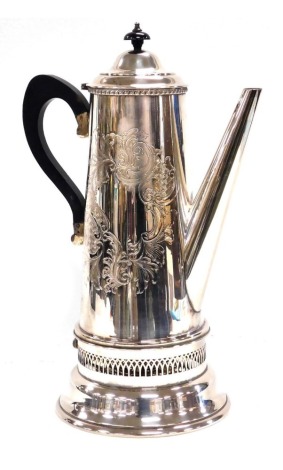 An early 20thC silver plated coffee pot, with engraved rococo scroll decoration, raised on a burner stand, 41cm high.