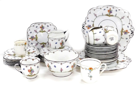 An early 20thC Bell porcelain Woodland pattern part tea service, printed marks, comprising cream jug, sugar bowl, pair of bread plates, five teacups, twelve saucers and eleven tea plates, together with a Shelley porcelain coffee cup and cream jug.