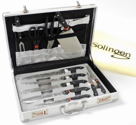 A Solingen chef's knive set, cased.