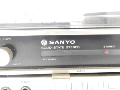 A Sanyo Solid State stereo system, model GXT 4540K, and a pair of Rank Organisation speakers, model number A1007. Buyer Note: WARNING! This lot contains untested or unsafe electrical items. It is supplied for scrap or reconditioning only. TRADE ONLY - 4