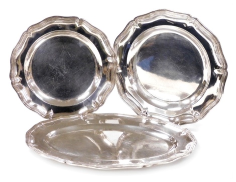 A pair of Christofle silver plated piecrust graduated salvers, impressed marks, 30cm and 33cm wide, together with a Cristofle oval meat platter, 45cm wide. (3)