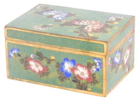 A Chinese cloisonne enamel cigarette box, decorated with chrysanthemums and other flowers, stamped to base China, 12cm wide.