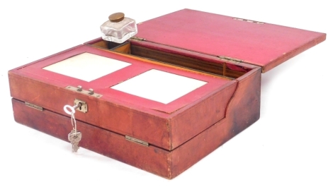 A Victorian red Morocco leather bound writing slope, with a recessed handle to the lid, gilt stamped D.N. from E.S, opening to reveal a fitted interior with inkwell, stationery and implement compartments, with keys, 13.5cm wide.