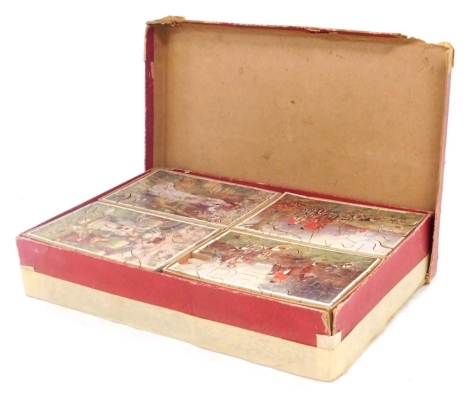 A set of twelve early 20thC wooden jigsaw puzzles, each with tray inset, boxed, one piece lacking.