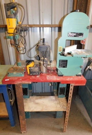 A work bench mounted with various bench tools, comprising a Matabo pillar drill, a Ferm Flz-275 band saw, a Ryobi 8¼ inch radial arm saw, together with a Master Sharp high speed drill sharpener, the bench 86cm high, 89cm wide, 80cm deep. Buyer Note: WARNI