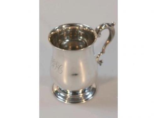 A George V silver mug of baluster design