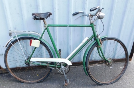 A Barker and Wigfall Royal bicycle, in green trim, with an AE Wilby Ltd leather seat.