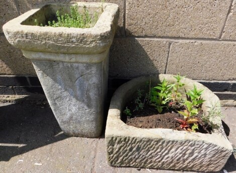 A composition plant pot, of square tapering form, 56cm high, together with a planter trough, 50cm wide.