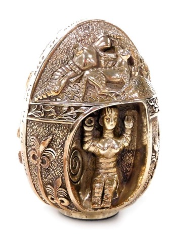 A Greek silver egg, embossed with figures, an octopus and shellfish, and Greek writing, stamped AG999, 7.98oz all in, 8cm high.