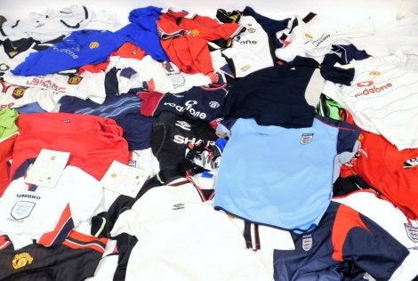 Manchester United England and other football shirts and apparel, some replicas. (a quantity)