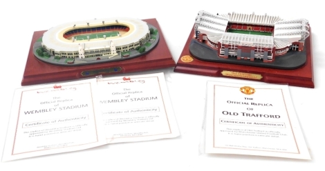 An official Manchester United replica of Old Trafford Stadium, with certificate, together with an official replica of Wembley Stadium, with certificates. (2)