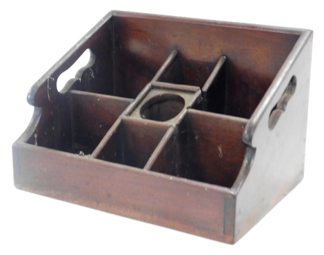 A Victorian mahogany caddy or housekeeper's box, with seven tiered compartments, 25.5cm wide.