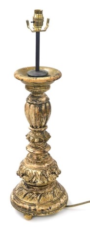 A late 19thC Continental painted wooden pricket candlestick, converted to a table lamp, 66cm high. Buyer Note: WARNING! This lot contains untested or unsafe electrical items. It is supplied for scrap or reconditioning only. TRADE ONLY