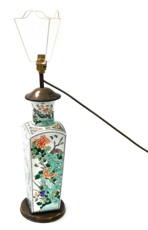 A Chinese famille rose porcelain table lamp, of shouldered square form, decorated with panels of flowers and flowers, birds and insects, 63cm high.