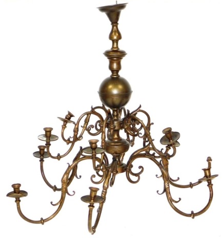 A brass effect Dutch style twelve branch chandelier, with turned centre support, scrolling arms, 116cm wide. (AF)