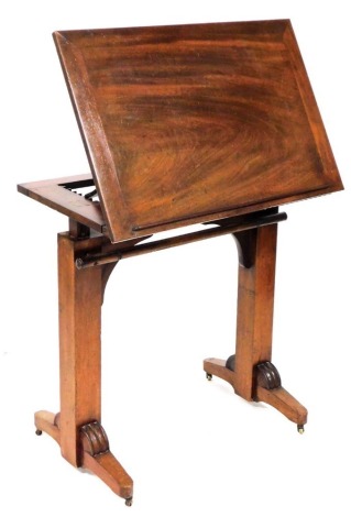 A William IV mahogany reading table, with a racheted adjustable top, and a newspaper rest below, raised on square supports, on castors, 74cm x 77.5cm x 52cm.