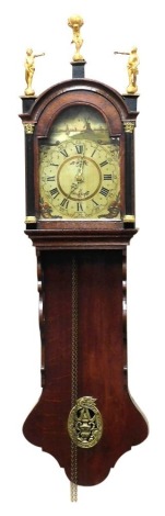 A 19thC Dutch oak cased wall clock, the brake out dial painted with a canal scene with windmill, and cornucopia of flowers, circular dial bearing Roman and Arabic numerals, single train movement, the hood with three gilt wood figural finials, and brass ca