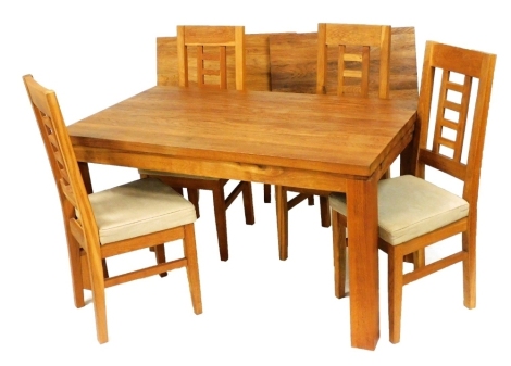 A late 20thC mango wood draw leaf dining table, raising a stiles, 75cm high, 140cm wide, 241cm extended, 81cm deep, together with four single dining chairs.