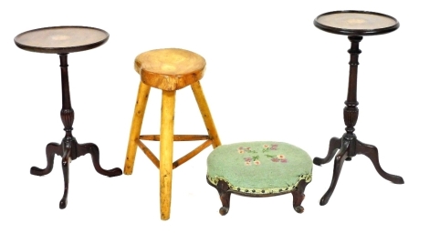 A Victorian mahogany footstool, upholstered in floral wool work, raised on cabriole legs, 33cm wide, a rustic stool, and two Georgian style mahogany wine tables, with sunburst paterae, each raised on a turned and fluted column over three cabriole legs, 53