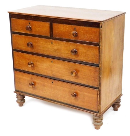 A Victorian oak chest, of two short over three long graduated drawers, raised on turned feet, 97cm high, 98cm wide, 48cm deep.