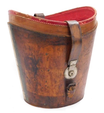 An early 20thC Drew & Sons tanned leather top hat box, lid lacking, 36cm wide.