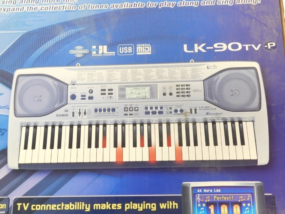 A Casio key lighting electric keyboard model LK 90TV P boxed