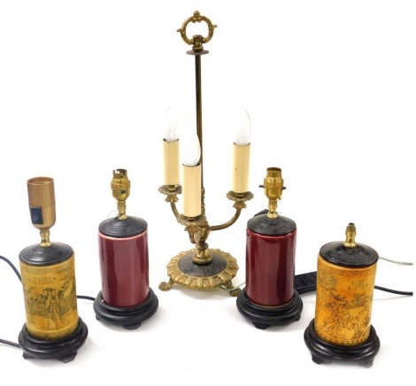 A Georgian style brass three branch table lamp, raised on paw feet, 52cm high, together with two pairs of Chinese table lamps. (5) Buyer Note: WARNING! This lot contains untested or unsafe electrical items. It is supplied for scrap or reconditioning only.