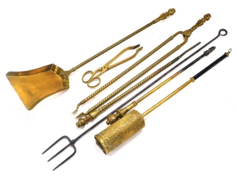 A group of Victorian and later fire irons, comprising a matching shovel, poker, and coal tongs, together with a pair of coal scissors, brush, etc. (a quantity)