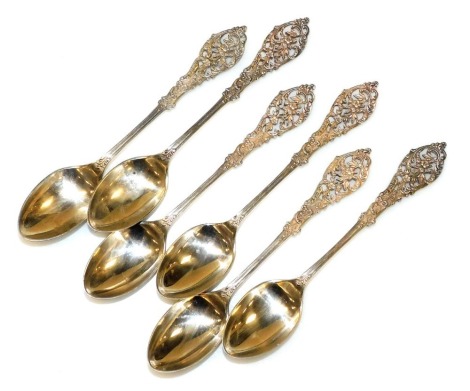 A set of six Victorian silver coffee spoons, each with a pierced foliate and leaf cast terminal, William Comyns and Sons, London 1899, 2.68oz.