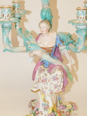 A 19thC Meissen five branch figural and flower encrusted candelabrum, modelled with a seated lady on four floral encrusted scroll feet, blue cross swords mark, 59cm high. - 2