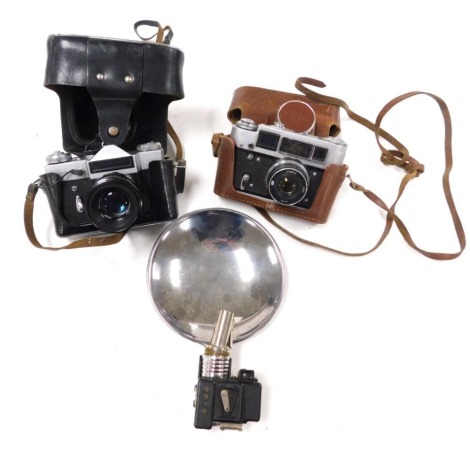 A Russian Fed4 camera, Zenit camera, and a vintage flash. (3)