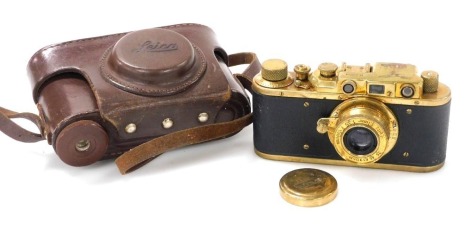 A Russian replica Leica camera, engraved for the Luftwaffe, 'Luftwaffen-Eigentum', number 21504, leather cased,