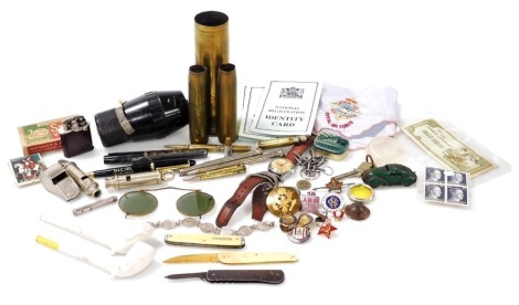 Military collectables, including shell cases, propelling pencil advertising Andrews' Liver Salts, enamel badges, Metropolitan Police whistle, Adie Bros World War II whistle 1941, identity cards, clay pipes, etc. (a quantity) Auctioneer Announce: ivory le